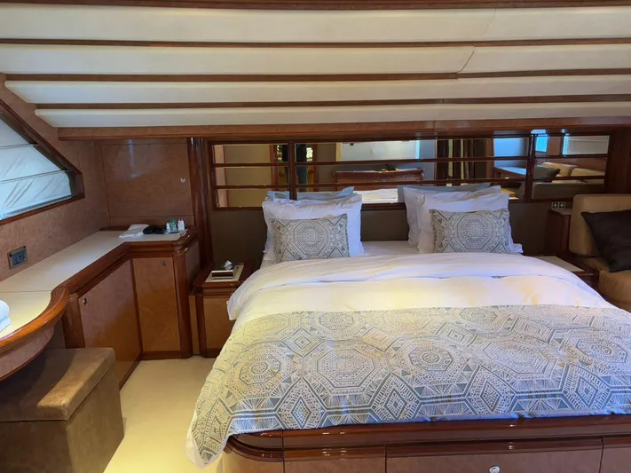 Queen Of Sheba Yacht Photos Pics Luxurious bedroom interior of 2006 Ferretti Yachts 112 Custom Line with elegant bedding and wood accents.