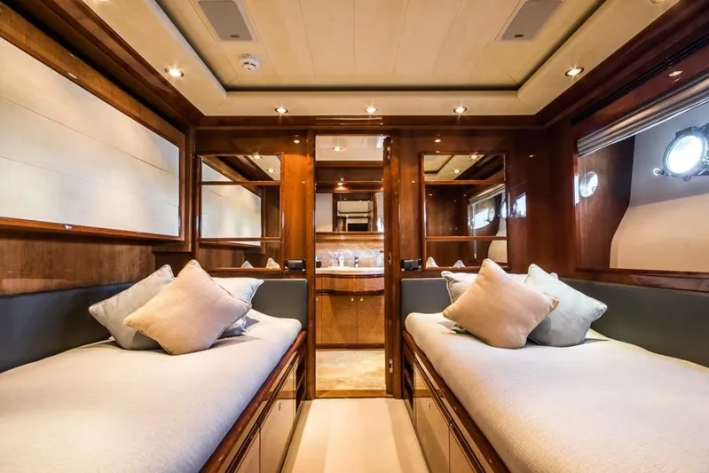 Queen Of Sheba Yacht Photos Pics Luxurious interior of 2006 Ferretti Yachts 112 Custom Line with twin beds and elegant wood finish.