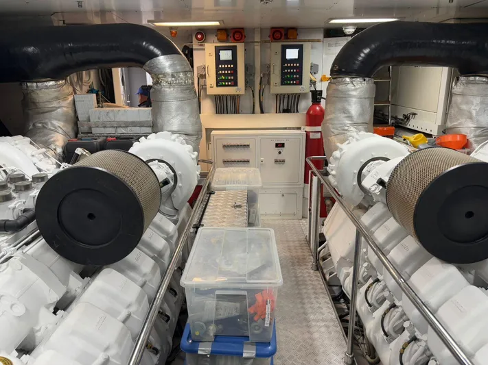 Queen Of Sheba Yacht Photos Pics Engine room of 2006 Ferretti Yachts 112 Custom Line with dual engines and control panels.