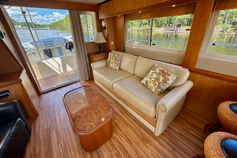 Blue Note Yacht Photos Pics Interior of 2007 Mainship 430 Trawler with elegant seating and scenic water view.