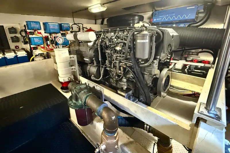 Blue Note Yacht Photos Pics Engine room of 2007 Mainship 430 Trawler, showcasing detailed mechanical components and wiring.
