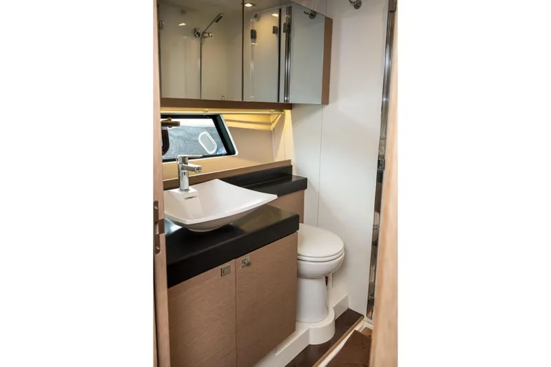  Yacht Photos Pics Luxurious bathroom in 2019 Prestige 500 yacht with modern fixtures and elegant design.