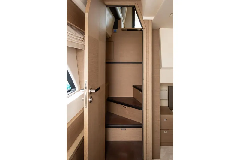  Yacht Photos Pics Interior view of 2019 Prestige 500 yacht staircase with wooden finish.