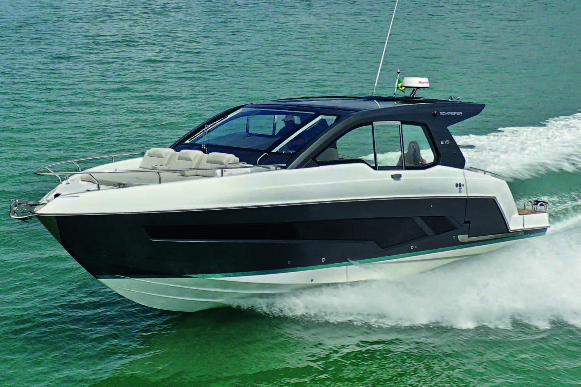 2025 Schaefer 375 HT yacht cruising on clear green water.