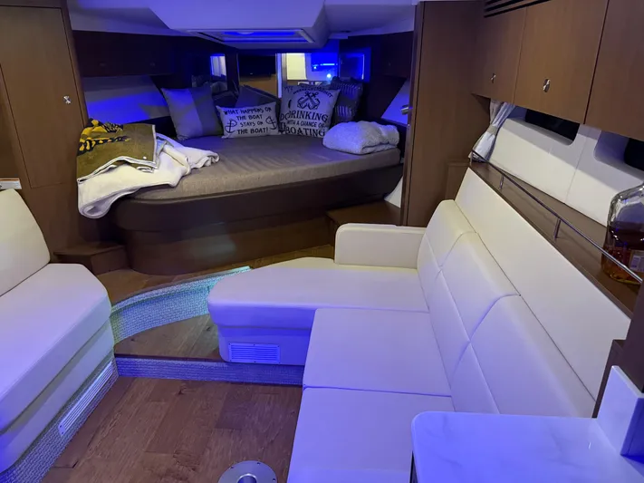  Yacht Photos Pics Interior of 2021 Sea Ray Sundancer 350 Coupe with cozy seating and ambient lighting.