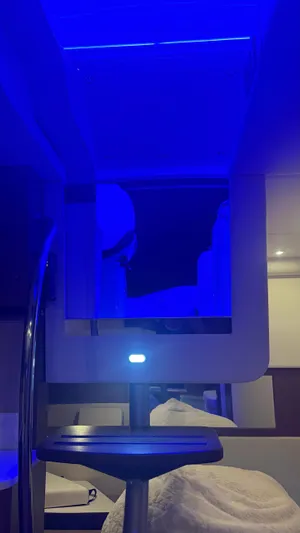  Yacht Photos Pics 2021 Sea Ray Sundancer 350 Coupe interior with blue ambient lighting and modern design.