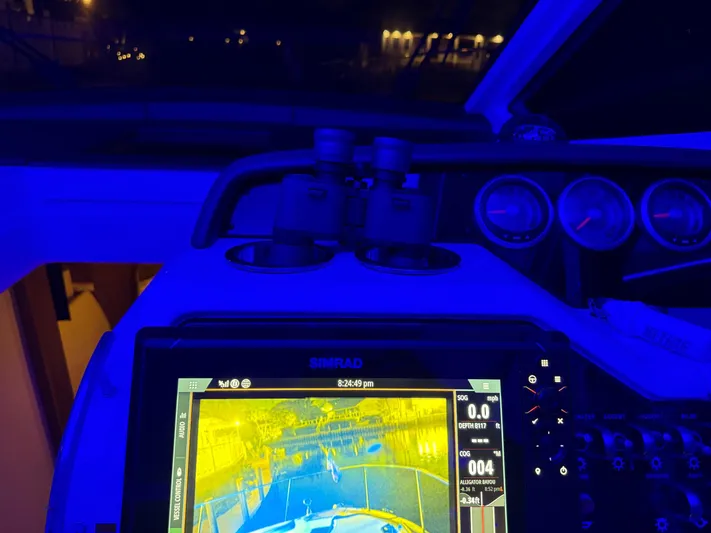  Yacht Photos Pics Control panel of 2021 Sea Ray Sundancer 350 Coupe with navigation display at night.