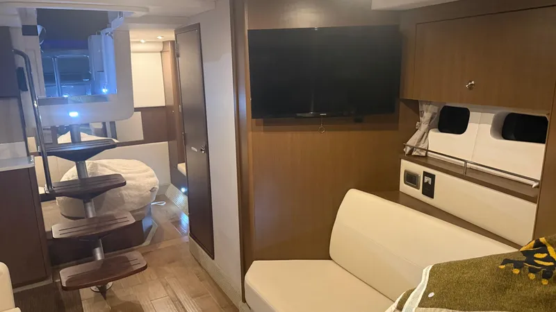  Yacht Photos Pics Interior of 2021 Sea Ray Sundancer 350 Coupe with modern furnishings and cozy seating area.