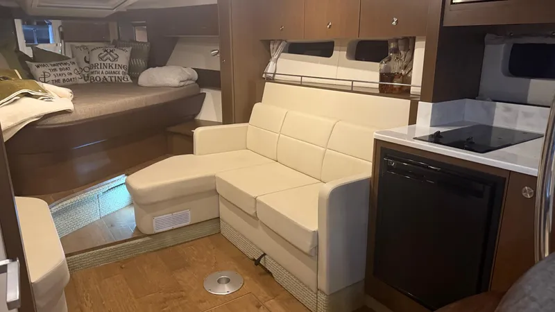 Yacht Photos Pics Interior of 2021 Sea Ray Sundancer 350 Coupe with cozy seating and modern amenities.