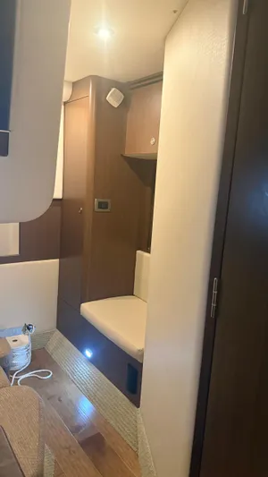  Yacht Photos Pics Interior of 2021 Sea Ray Sundancer 350 Coupe, featuring modern wood finishes and seating.