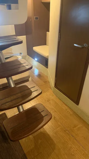  Yacht Photos Pics Interior of 2021 Sea Ray Sundancer 350 Coupe, featuring wooden steps and modern design.