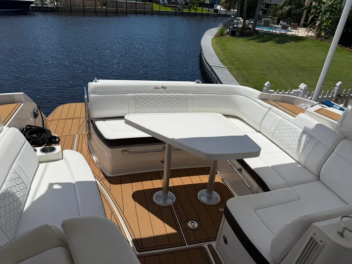  Yacht Photos Pics Luxurious seating area on 2021 Sea Ray Sundancer 350 Coupe by the water.
