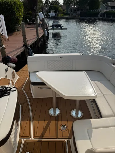 Yacht Photos Pics 2021 Sea Ray Sundancer 350 Coupe boat with elegant seating and table on deck.