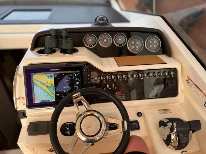  Yacht Photos Pics Helm of 2021 Sea Ray Sundancer 350 Coupe with navigation display and controls.