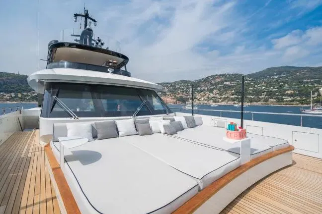  Yacht Photos Pics Luxurious 2023 Benetti Motopanfilo 37M yacht with spacious sun deck and scenic coastal view.