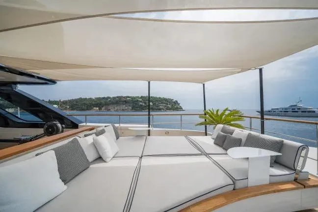  Yacht Photos Pics Luxurious 2023 Benetti Motopanfilo 37M yacht deck with elegant seating and ocean view.