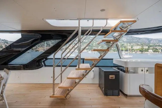  Yacht Photos Pics Modern interior of 2023 Benetti Motopanfilo 37M yacht with sleek staircase and scenic view.