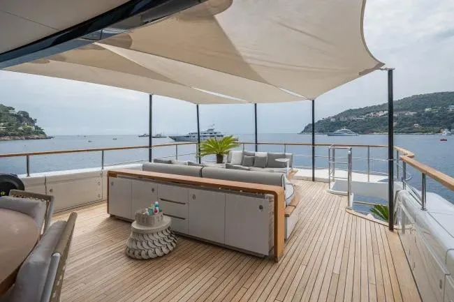  Yacht Photos Pics Luxurious 2023 Benetti Motopanfilo 37M yacht deck with elegant seating and ocean view.