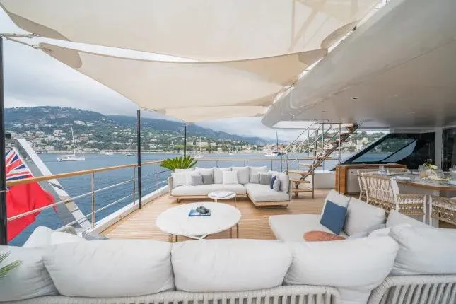  Yacht Photos Pics Luxurious Benetti Motopanfilo 37M yacht deck with elegant seating, ocean view, and shaded canopy, 2023 model.