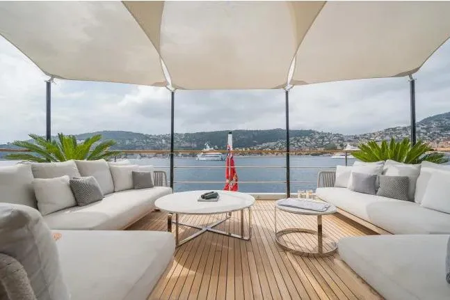  Yacht Photos Pics Luxurious 2023 Benetti Motopanfilo 37M yacht deck with elegant seating and scenic ocean view.