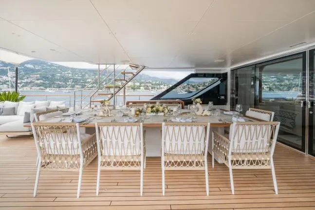  Yacht Photos Pics Luxurious dining area on 2023 Benetti Motopanfilo 37M yacht with elegant table setting.