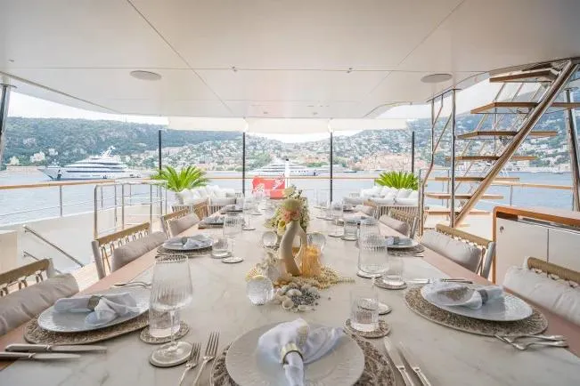  Yacht Photos Pics Luxurious dining area on 2023 Benetti Motopanfilo 37M yacht with scenic ocean view.