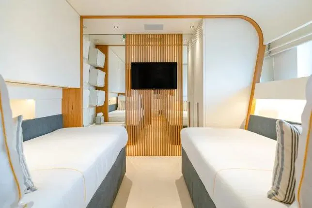  Yacht Photos Pics Luxurious twin bedroom on 2023 Benetti Motopanfilo 37M yacht, featuring modern design and elegant decor.