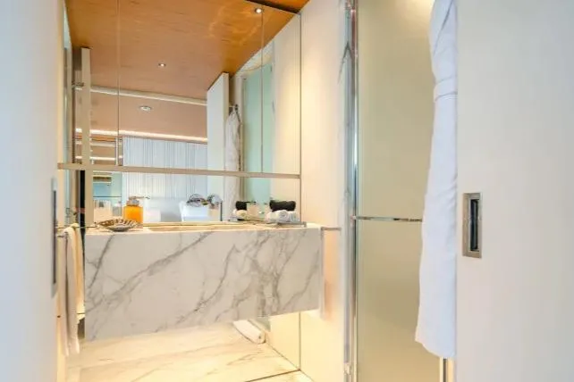  Yacht Photos Pics Luxurious bathroom interior on 2023 Benetti Motopanfilo 37M yacht, featuring marble sink and modern design.
