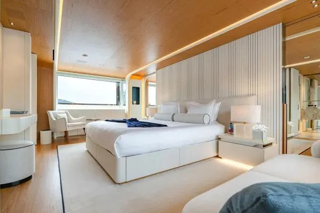  Yacht Photos Pics Luxurious bedroom interior on 2023 Benetti Motopanfilo 37M yacht, featuring modern design and ocean view.