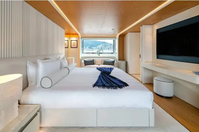  Yacht Photos Pics Luxurious bedroom interior on 2023 Benetti Motopanfilo 37M yacht, featuring elegant design and scenic view.