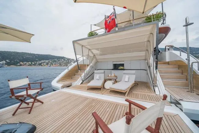  Yacht Photos Pics Luxurious 2023 Benetti Motopanfilo 37M yacht deck with elegant seating and scenic ocean view.