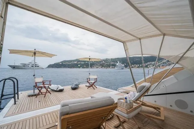 Yacht Photos Pics Luxurious deck of 2023 Benetti Motopanfilo 37M yacht with sea view and lounge chairs.