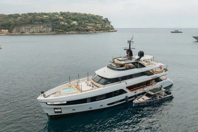  Yacht Photos Pics Luxury Benetti Motopanfilo 37M yacht, 2023 model, anchored near scenic coastline.