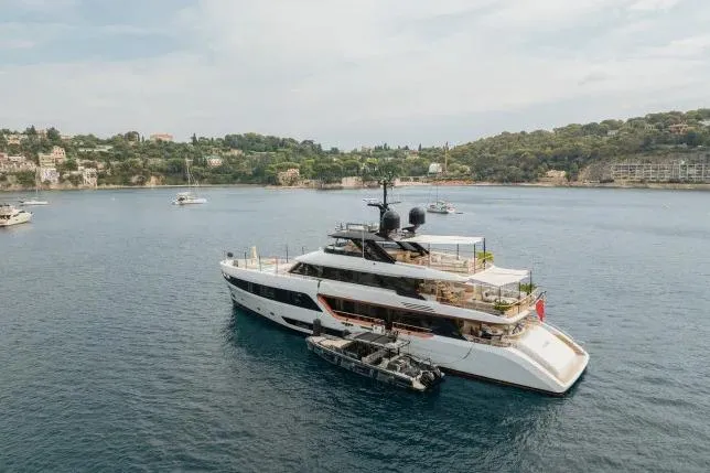  Yacht Photos Pics Luxury yacht Benetti Motopanfilo 37M 2023 anchored in scenic coastal waters.