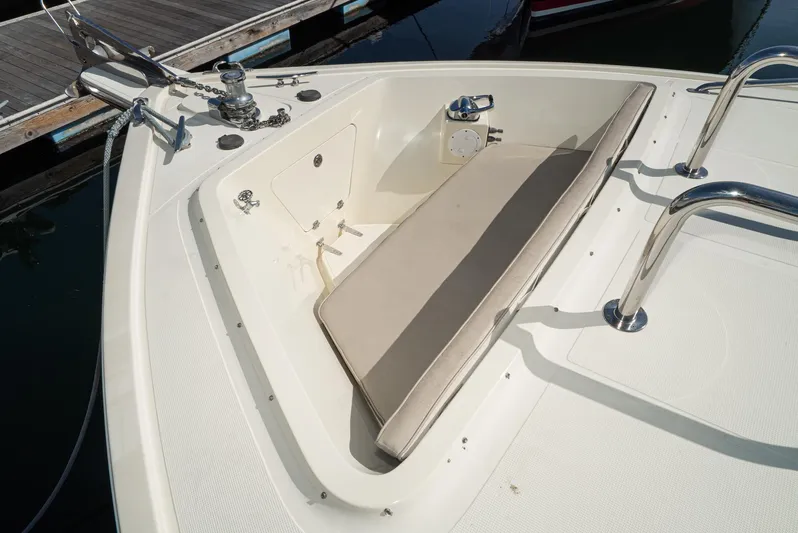 Nick Of Time Yacht Photos Pics 2007 Midnight Lace Sport Cruiser bow with anchor, seating, and stainless steel railings.