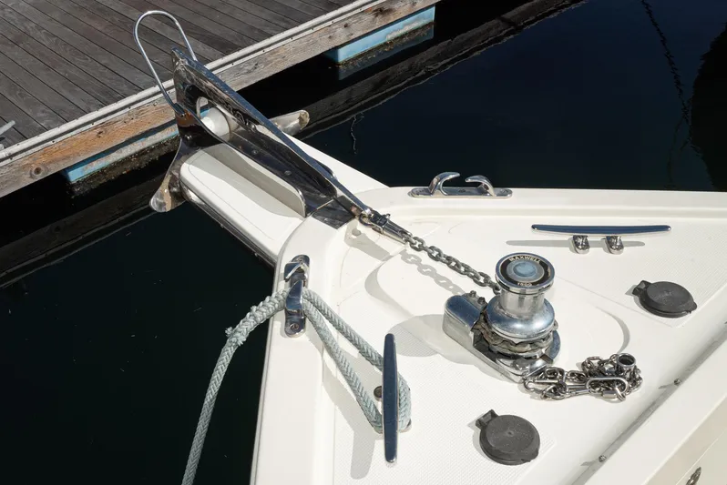 Nick Of Time Yacht Photos Pics Bow of 2007 Midnight Lace Sport Cruiser with anchor and winch at dock.