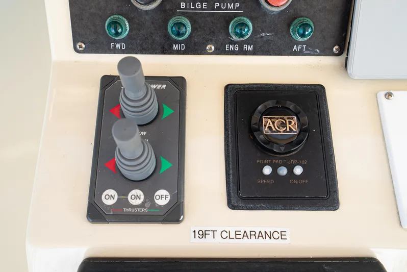 Nick Of Time Yacht Photos Pics Control panel of a 2007 Midnight Lace Sport Cruiser with thruster and bilge pump controls.
