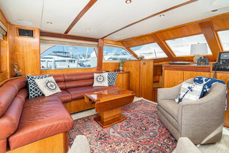 Nick Of Time Yacht Photos Pics Luxurious 2007 Midnight Lace Sport Cruiser interior with leather seating and nautical decor.