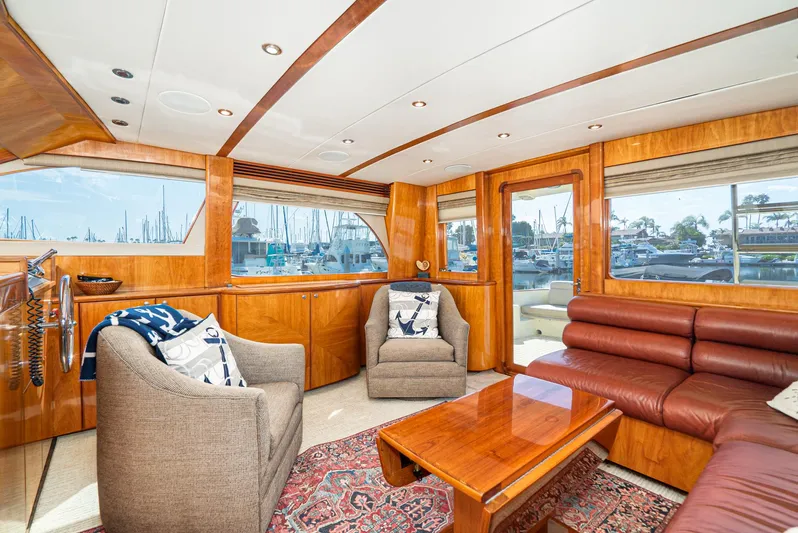 Nick Of Time Yacht Photos Pics Luxurious 2007 Midnight Lace Sport Cruiser interior with elegant wood finishes and marina view.