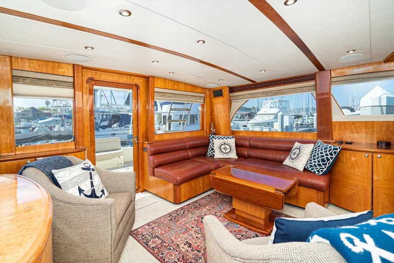 Nick Of Time Yacht Photos Pics Luxurious 2007 Midnight Lace Sport Cruiser interior with leather seating and nautical decor.