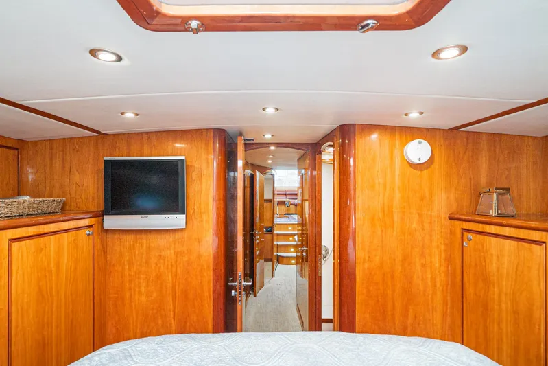 Nick Of Time Yacht Photos Pics Luxurious 2007 Midnight Lace Sport Cruiser interior with wood paneling and modern amenities.