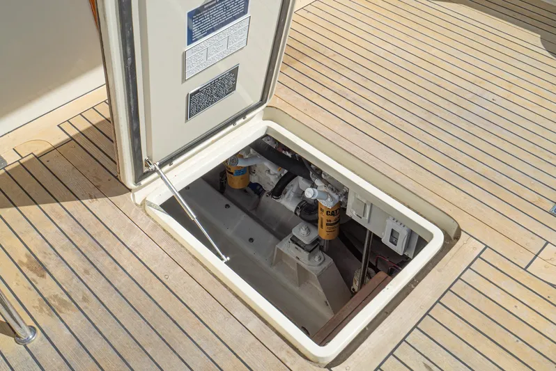 Nick Of Time Yacht Photos Pics Open hatch on 2007 Midnight Lace Sport Cruiser, revealing engine components.