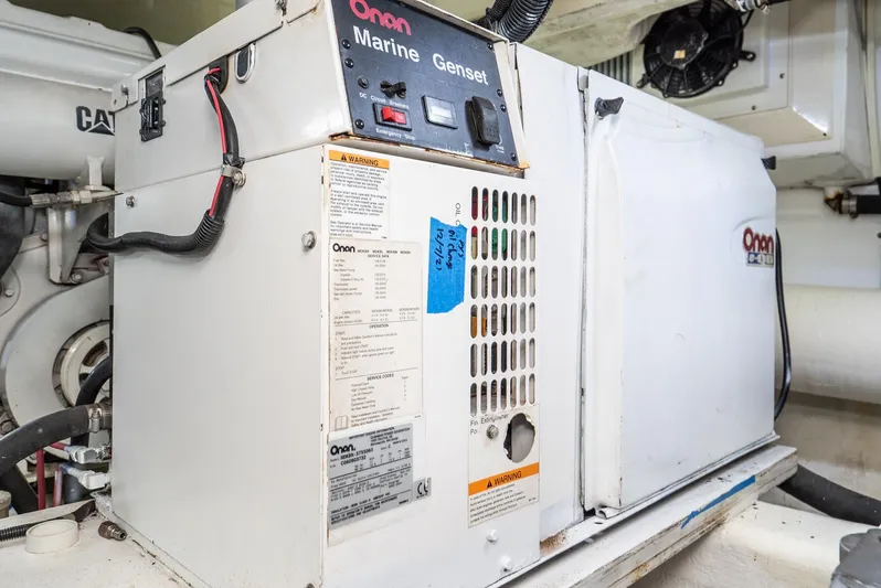 Nick Of Time Yacht Photos Pics Onan Marine Genset in 2007 Midnight Lace Sport Cruiser engine room.