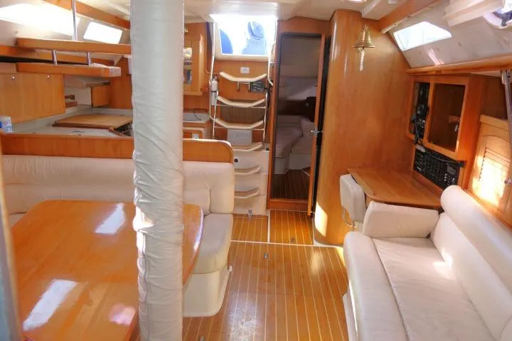 Right Action Yacht Photos Pics Interior of 2008 Catalina 400 MK II sailboat with wood finish and comfortable seating.
