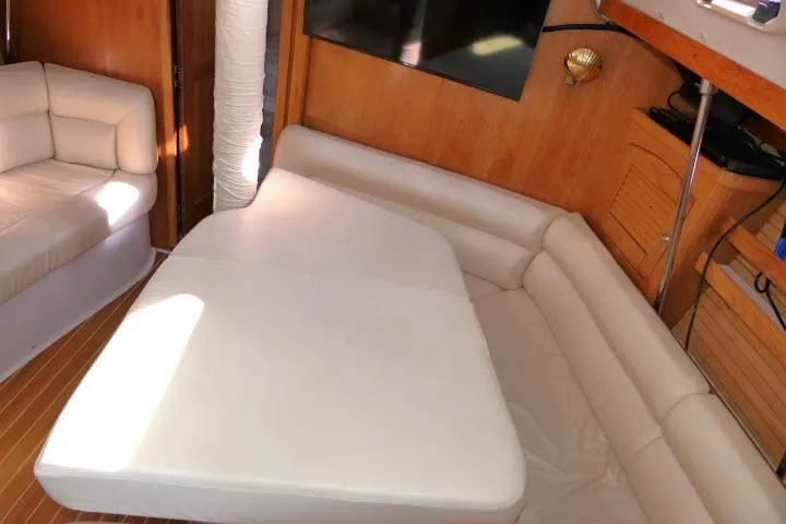 Right Action Yacht Photos Pics Luxurious interior of 2008 Catalina 400 MK II yacht with plush seating and wooden accents.