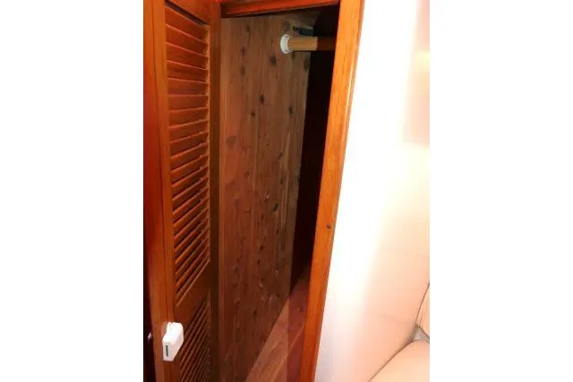 Right Action Yacht Photos Pics Wooden closet interior on a 2008 Catalina 400 MK II sailboat.