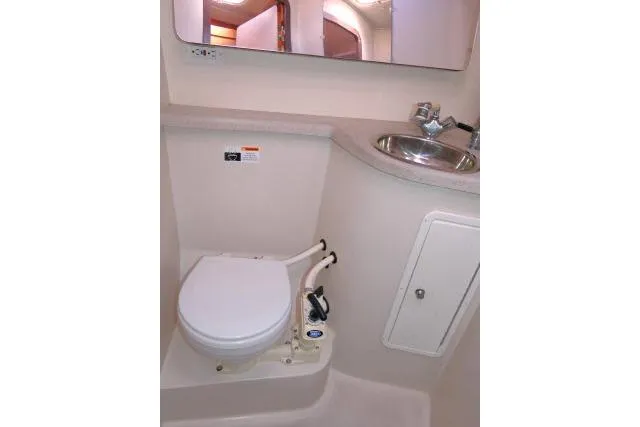Right Action Yacht Photos Pics 2008 Catalina 400 MK II yacht bathroom with toilet, sink, and mirror.