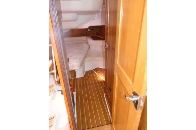 Right Action Yacht Photos Pics Interior view of 2008 Catalina 400 MK II sailboat cabin with wooden flooring.