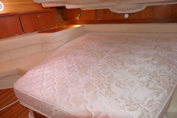 Right Action Yacht Photos Pics Luxurious cabin interior of 2008 Catalina 400 MK II sailboat with spacious bed.