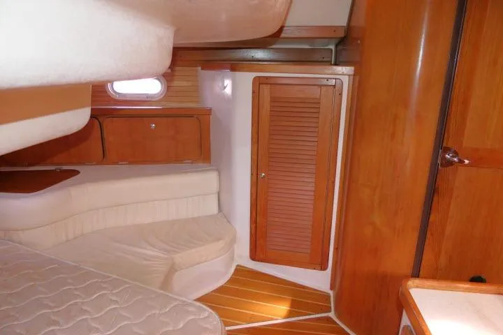 Right Action Yacht Photos Pics Interior of 2008 Catalina 400 MK II sailboat with wooden cabinetry and cozy seating area.